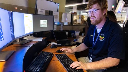 Kevin Beaty, an Atlanta Police Department system administrator, prepares a demonstration of the newly implemented Carbyne Universe emergency response system at Atlanta’s E-911 center.