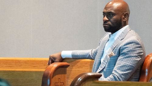 Nathan Wade listens as Fulton County DA Fani Willis addresses the Sixth Episcopal District of the African Methodist Episcopal Church in Marietta on June 13, 2024. (Ben Gray / Ben@BenGray.com)