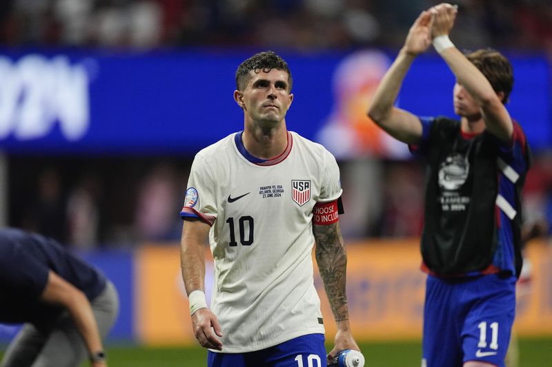 Christian Pulisic of the United States leaves the field after losing 1-2 against Panama at the end of a Copa America Group C soccer match in Atlanta, Thursday, June 27, 2024. (AP Photo/Mike Stewart)