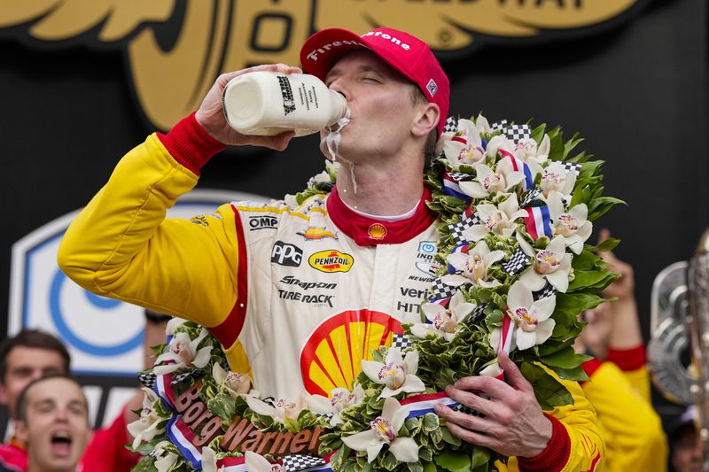 Josef Newgarden celebrates after winning the Indianapolis 500 auto race at Indianapolis Motor Speedway in Indianapolis, Sunday, May 26, 2024. (AP Photo/Michael Conroy)