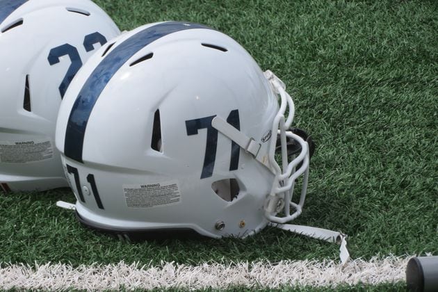 Fellowship Christian Paladins helmets rest on the field at Barron Stadium in Rome on Aug. 19, 2022 during the 31st annual Corky Kell Classic. (Adam Krohn/for the AJC)