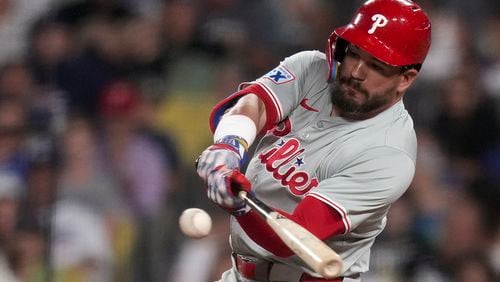 Philadelphia Phillies designated hitter Kyle Schwarber hits a home run during the sixth inning of a baseball game against Los Angeles Dodgers in Los Angeles, Wednesday, Aug. 7, 2024. (AP Photo/Eric Thayer)