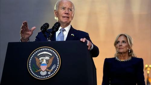 President Joe Biden speaks at a reception at the Metropolitan Museum of Art, Wednesday, Sept. 25, 2024, in New York, as first lady Jill Biden listens. (AP Photo/Manuel Balce Ceneta)