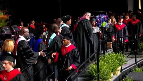 The Druid Hills High School senior class of 2024 receives their diplomas during the graduation ceremony. Photo Credit: DeKalb County School District.