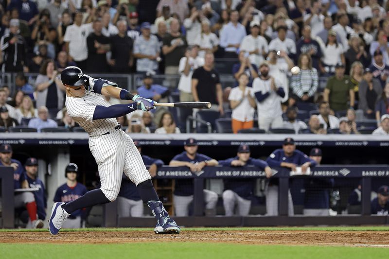 New York Yankees' Aaron Judge hits a grand slam during the seventh inning of a baseball game at bat Friday, Sept. 13, 2024, in New York. (AP Photo/Adam Hunger)