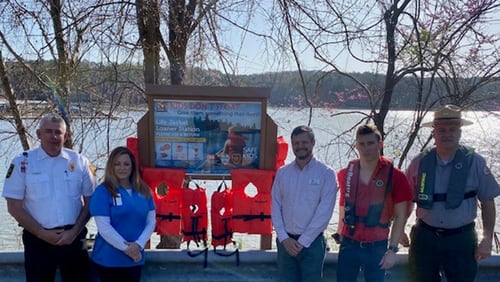 Cherokee County's new life jacket loaner station will serve as a potentially lifesaving reminder to local boaters. Pictured L to R: Chief Chad Arp, Fire Marshal, Community Risk Reduction Division, Cherokee County Fire and Emergency Services; Lisa Grisham, Safe Kids Cherokee County Coordinator, Community Risk Reduction Division, Cherokee County Fire and Emergency Services; Jordan Wood, Parks Division Director, Cherokee Recreation and Parks; Hunter Baird, Captain, Tow Boat U.S.; Chris Purvis, Lead Ranger, Allatoona Lake, U.S. Army Corps of Engineers. 

Photo credit - Tim Cavender