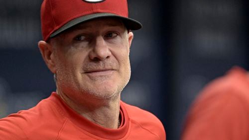 FILE - Cincinnati Reds manager David Bell stands in the dugout during a baseball game against the Tampa Bay Rays, July 28, 2024, in St. Petersburg, Fla. (AP Photo/Steve Nesius, File)