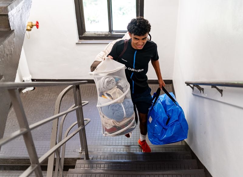 Rafa Bashizi, an incoming freshman from Marietta, heads to his new dorm at Smith Residence Hall at Georgia Tech.