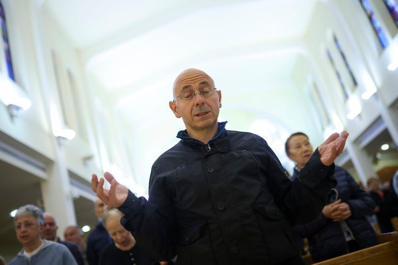 A pilgrim recites his prayers inside the St. James Church in Medjugorje, Bosnia, Thursday, Sept. 19, 2024. (AP Photo/Armin Durgut)