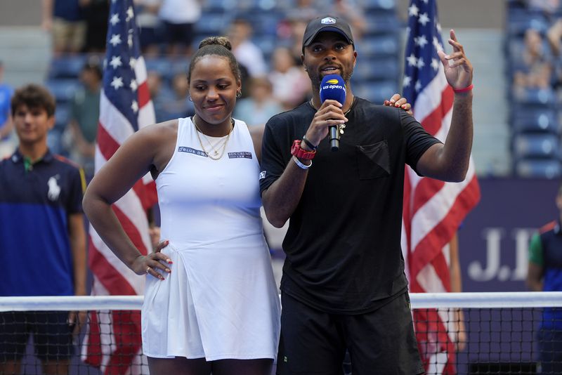 Donald Young, right, and Taylor Townsend, of the United States, talk to the crowd after loosing to Sara Errani, of Italy, and Andrea Vavassori, of Italy, during the mixed doubles final of the U.S. Open tennis championships, Thursday, Sept. 5, 2024, in New York. (AP Photo/Julia Nikhinson)