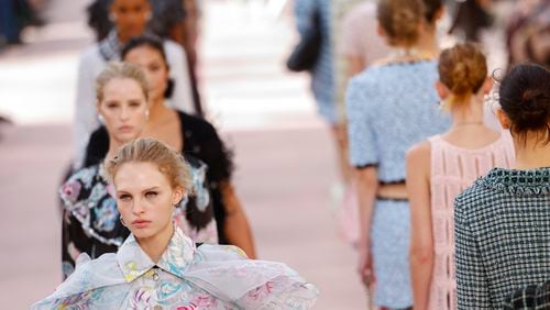 Models wear creations as part of the Chanel Spring/Summer 2025 collection presented Tuesday, Oct. 1, 2024, in Paris. (Photo by Vianney Le Caer/Invision/AP)