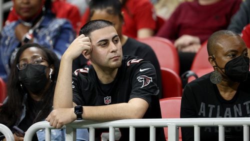 Atlanta Falcons fans react during the second half of the team's 30-20 loss to the Saints on Jan. 9 at Mercedes-Benz Stadium. (AJC photo by Jason Getz)