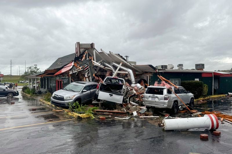 In this photo provided by the City of Rocky Mount, cars are piled along the side of Hing Ta Restaurant after a tornado hit Rocky Mount, N.C., on Friday, Sept. 27, 2024. (City of Rocky Mount via AP)