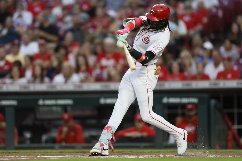 Cincinnati Reds' Elly De La Crux hits a double against the Atlanta Braves during the first inning of a baseball game Tuesday, Sept. 17, 2024, in Cincinnati. (AP Photo/Jay LaPrete)