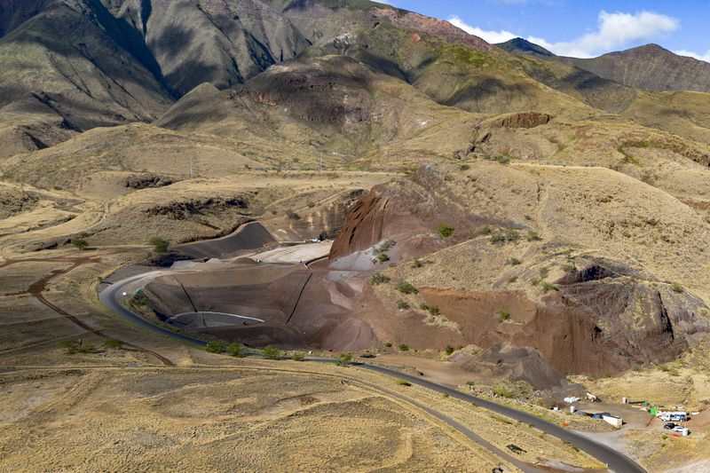 Olowalu temporary landfill site for the debris from the Lahaina fire is seen on Sunday, July 7, 2024, in Lahaina, Hawaii. (AP Photo/Mengshin Lin)