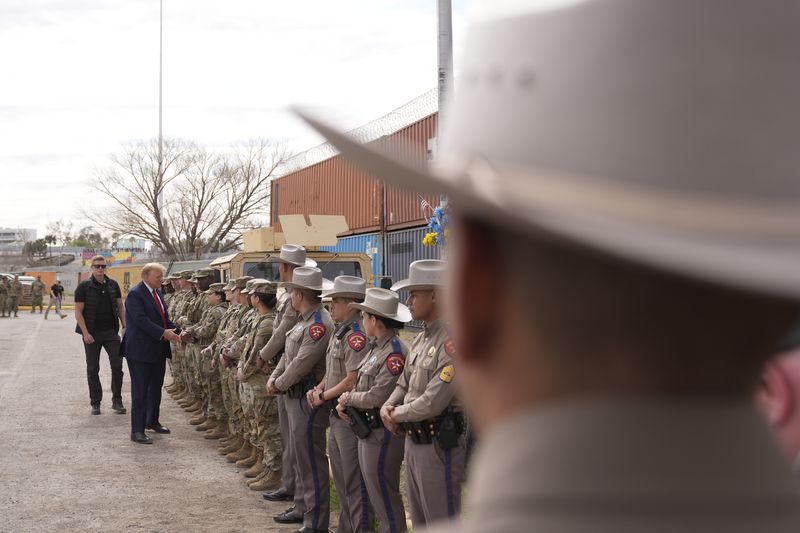 FILE - Republican presidential candidate former President Donald Trump gets members of the National Guard at Shelby Park during a visit to the U.S.-Mexico border, on Feb. 29, 2024, in Eagle Pass, Texas. (AP Photo/Eric Gay, File)