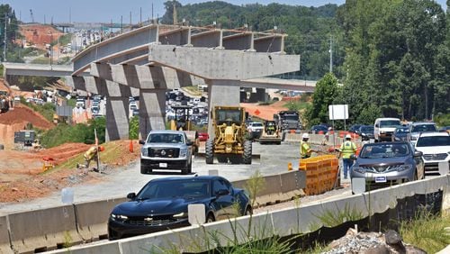 Construction work at the interchange of I-285 and Ga. 400 on Aug. 8, 2019. (Hyosub Shin / Hyosub.Shin@ajc.com)