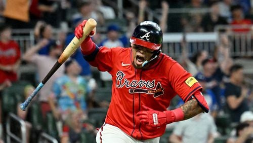 Atlanta Braves shortstop Orlando Arcia reacts after hitting an RBI single to score Austin Riley (27) during the eighth inning at Truist Park on Friday. The Braves won 5-3 over the Miami Marlins. (Hyosub Shin / AJC)
