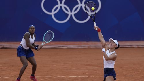 Coco Gauff and Jessica Pegula of the United States play Linda Noskova and Karolina Muchova of the Czech Republic during their women's doubles match, at the 2024 Summer Olympics, Wednesday, July 31, 2024, at the Roland Garros stadium in Paris, France. (AP Photo/Andy Wong)