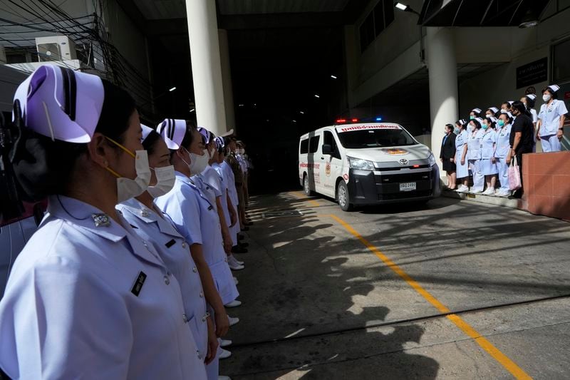 An ambulance carrying a body leaves from the Police hospital in Bangkok, Thailand, Wednesday, Oct. 2, 2024, (AP Photo/Sakchai Lalit)