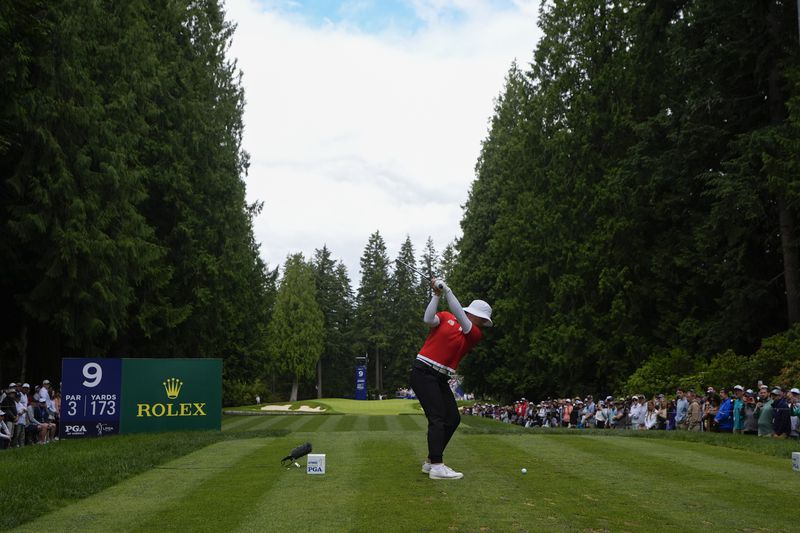 Amy Yang, of South Korea, hits from the ninth tee during the final round of the Women's PGA Championship golf tournament at Sahalee Country Club, Sunday, June 23, 2024, in Sammamish, Wash. (AP Photo/Lindsey Wasson)