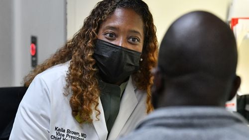 Dr. Keila Brown (left), vice president and chief health officer, confers with Dr. Dale Kesley Robertson at the Family Health Center at West End, Thursday, May 11, 2023, in Atlanta. The loss of hospital services at Atlanta Medical Center’s two locations in downtown and East Point is the subject of plans and discussion for both Atlanta and Fulton County elected officials. While leaders say they want new clinics and health facilities, existing clinics say they already reach out to the same people, offering care to the poor and uninsured.(Hyosub Shin / Hyosub.Shin@ajc.com)