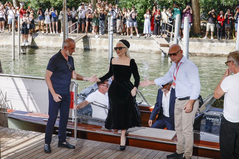 Lady Gaga, centre, upon arrival for the press conference of the film 'Joker: Folie A Deux' during the 81st edition of the Venice Film Festival in Venice, Italy, on Wednesday, Sept. 4, 2024. (Photo by Joel C Ryan/Invision/AP)