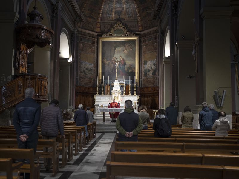 Congregants attend morning Mass at the Notre-Dame du Mont church in Marseille, southern France, Thursday, April 25, 2024. (AP Photo/Daniel Cole)