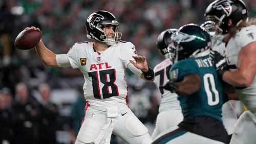 Atlanta Falcons quarterback Kirk Cousins (18) looks to pass during the first half of an NFL football game against the Philadelphia Eagles on Monday, Sept. 16, 2024, in Philadelphia. (AP Photo/Matt Rourke)