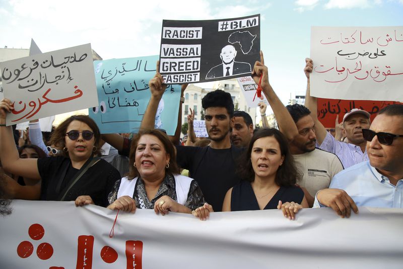 Tunisian take part in a protest against President Kais Saied ahead of the upcoming presidential elections, Friday, Sept. 13, 2024, on Avenue Habib Bourguiba in the capital Tunis. (AP Photo/Anis Mili)