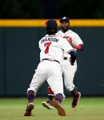 Atlanta Braves shortstop Dansby Swanson (7) makes an over the shoulder catch of the popup by Philadelphia Phillies’ J.T. Realmuto during the sixth inning of game two of the National League Division Series at Truist Park in Atlanta on Wednesday, October 12, 2022. (Jason Getz / Jason.Getz@ajc.com)