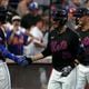 New York Mets' Jeff McNeil, left, J.D. Martinez, center, and Brandon Nimmo, right, celebrate after Martinez hit a grand slam also leading to Nimmo, Francisco Lindor and Tyrone Taylor to score during the third inning of a baseball game against the Atlanta Braves, Friday, July 26, 2024, in New York. (AP Photo/Pamela Smith)