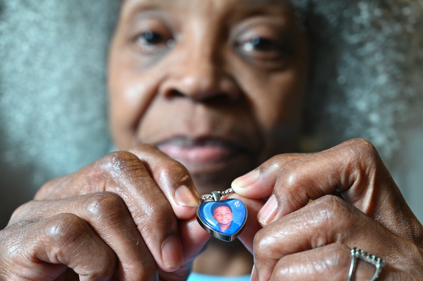 June 8, 2021 Atlanta - Glenda Mack holds a necklace that includes a photo of her grandson David. The 12-year-old was found shot to death in February 2021, not far from their southwest Atlanta home.(Hyosub Shin / Hyosub.Shin@ajc.com)