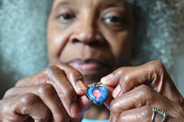 June 8, 2021 Atlanta - Glenda Mack holds a necklace that includes a photo of her grandson David. The 12-year-old was found shot to death in February, not far from their southwest Atlanta home.(Hyosub Shin / Hyosub.Shin@ajc.com)