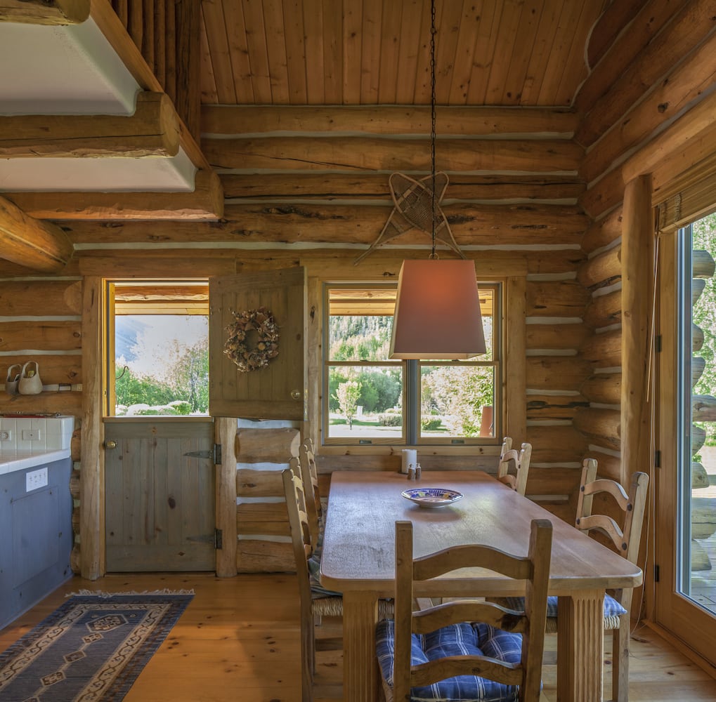 500-acre property has log cabins, mountain views