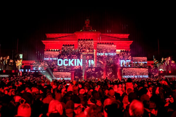 Musicians play on the stage during the concert for freedom for the 35th anniversary of the fall of the Berlin Wall, at the Brandenburg Gate in Berlin, Germany, Saturday, Nov. 9, 2024. (AP Photo/Ebrahim Noroozi)