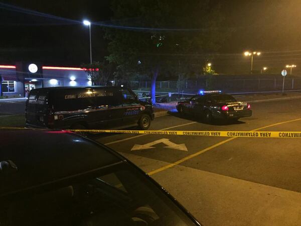 Police cars are parked near a Burger King on Donald Lee Hollowell Parkway on April 24, 2016 in response to a double homicide. (AJC file)