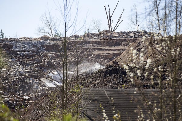 Smoke can be seen rising from an unlicensed landfill, located at 7635 Bishop Road, in South Fulton, Wednesday, February 13, 2019. (ALYSSA POINTER/ALYSSA.POINTER@AJC.COM)