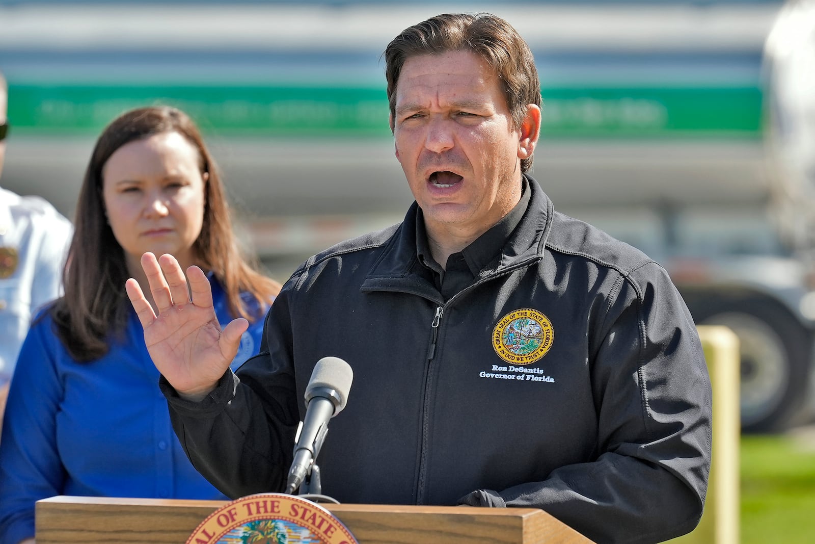 Florida Gov. Ron DeSantis holds a news conference at a fuel depot in Plant City, Fla., Saturday, Oct. 12, 2024, accompanied by Florida Attorney General Ashley Moody, right. Gas station are slow to open after the effects of Hurricane Milton. (AP Photo/Chris O'Meara)