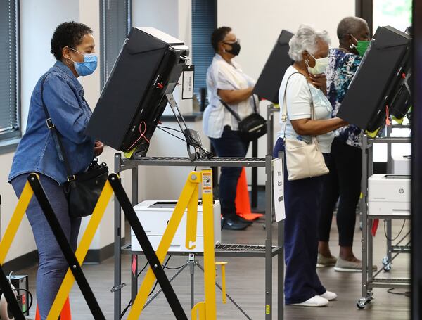 The Cobb County elections board on Monday is considering challenges to the eligibility of 1,350 voters, most of whom are people of color. In the photo, voters ballots on the first day of early voting at the Cobb County Board of Elections' registration on May 18, 2020, in Marietta, Georgia. (Curtis Compton / Atlanta Journal-Constitution / TNS)