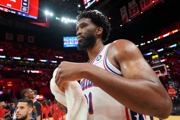 Philadelphia 76ers center Joel Embiid walks off the court after an NBA basketball game against the Miami Heat, Monday, Nov. 18, 2024, in Miami. (AP Photo/Lynne Sladky)