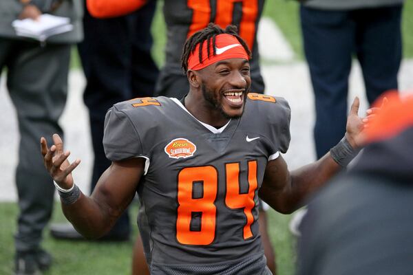 National Team wide receiver Frank Darby of Arizona State (84) smiles on the sidelines during the second half of the NCAA college football Senior Bowl in Mobile, Ala, Saturday, Jan. 30, 2021. (AP Photo/Rusty Costanza)