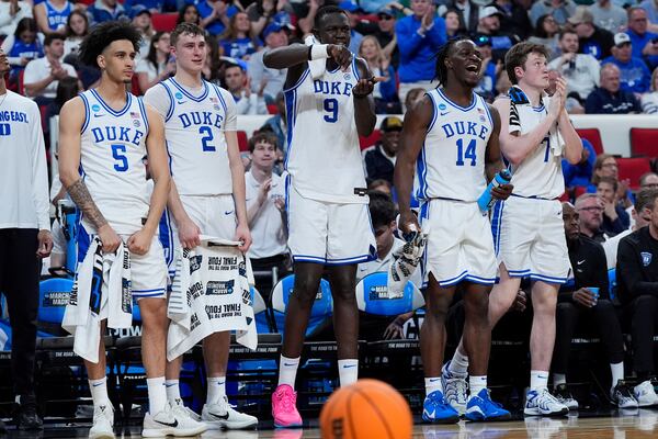 From left, Duke guard Tyrese Proctor (5), forward Cooper Flagg (2), center Khaman Maluach (9), guard Sion James (14) and guard Kon Knueppel (7) react to their team's lead during the second half in the first round of the NCAA college basketball tournament against Mount St. Mary's, Friday, March 21, 2025, in Raleigh, N.C. (AP Photo/Stephanie Scarbrough)