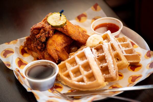 Joella's  Chicken and Waffles with maple syrup and spiked honey. Photo credit- Mia Yakel.