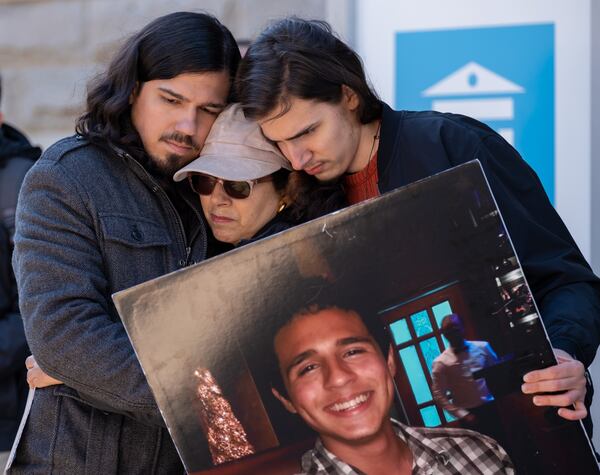 230313-Decatur-Manuel ÒTortuguitaÓ TeranÕs brother Daniel Paez, from left, mother Belkis Teran and brother Pedro Santema hug after Belkis Teran spoke during a press conference Monday, March 13, 2023, in Decatur to speak about the results of an autopsy they commissioned. Ben Gray for the Atlanta Journal-Constitution