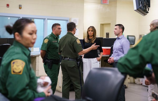 First lady Melania Trump talks with border patrol agents as she visits a processing center of a U.S. Customs and border and protection facility in Tuscan, Ariz., Thursday, June 28, 2018.