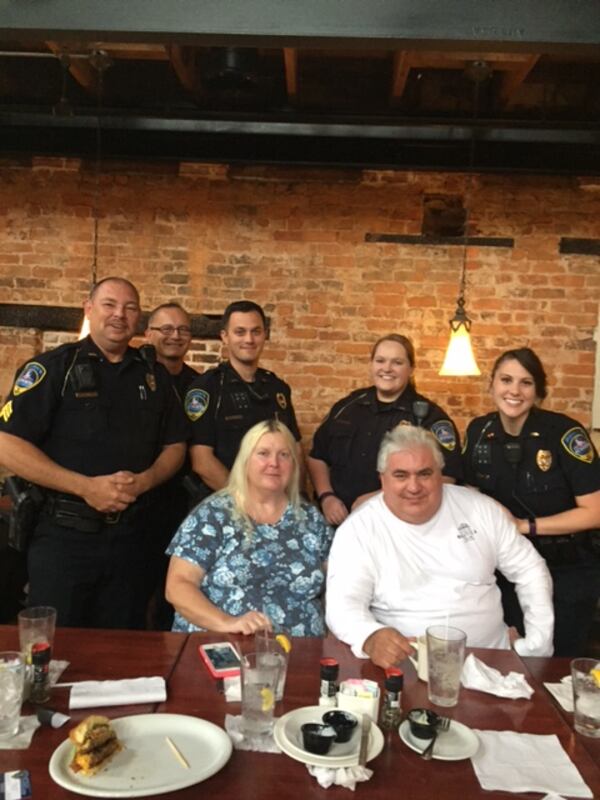 Gloria (front left) and Theodore Karadimos bought dinner for members of the Acworth Police Department. (Credit: Acworth Police Department)