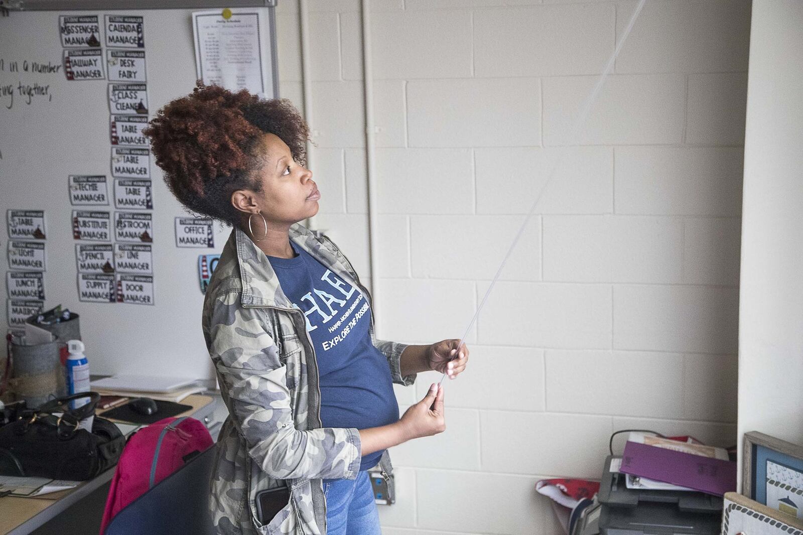 Harper-Archer Elementary School kindergarten teacher Lindsy Hall closes the blinds in her classroom following a staff meeting at Harper-Archer Elementary School in Atlanta on March, 13, 2020. That day, Atlanta Public Schools closed its facilities to students and staff due to try to stop the spread of the coronavirus. (ALYSSA POINTER/ALYSSA.POINTER@AJC.COM)