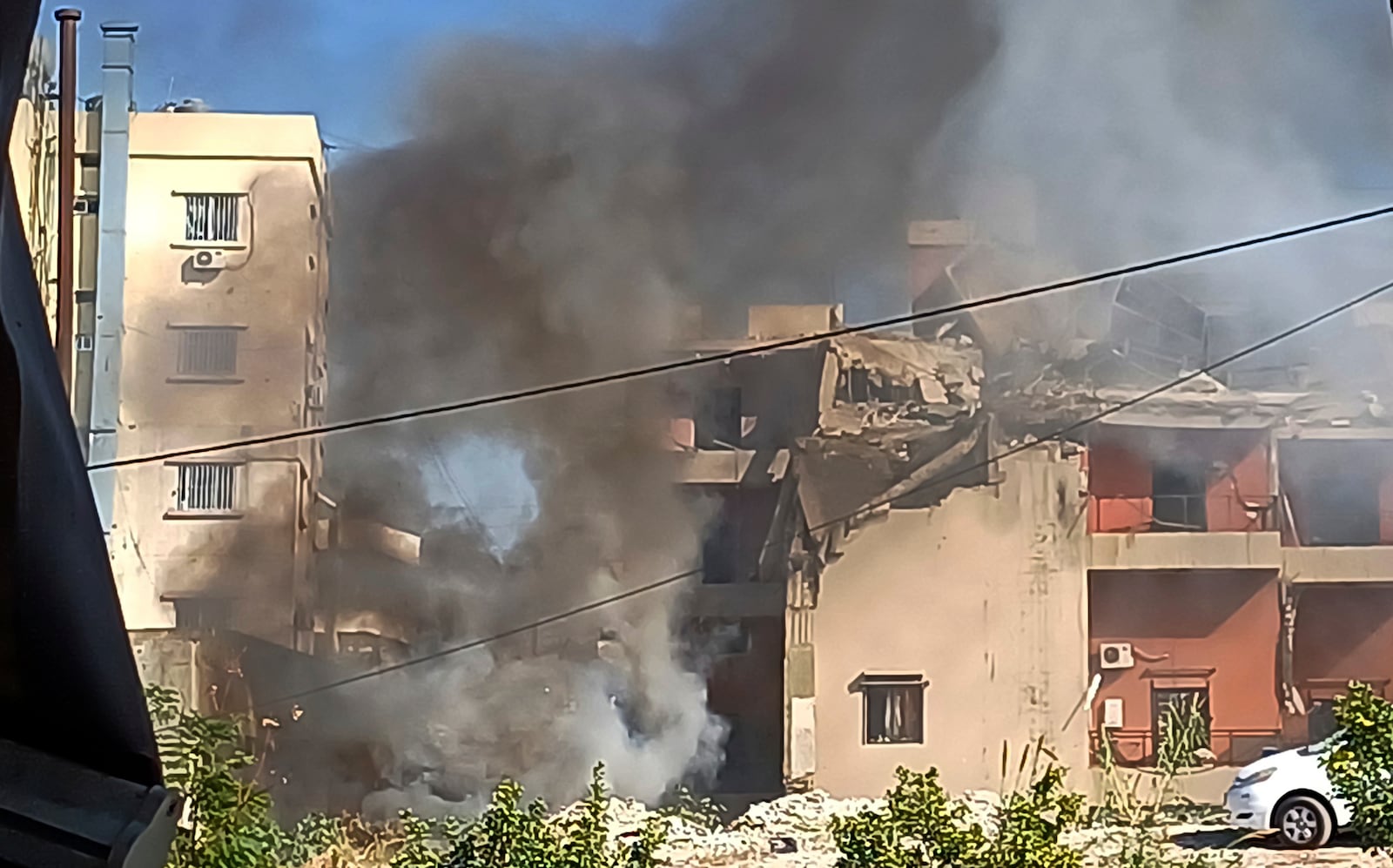 Smoke rises from a building hit by an Israeli airstrike, in the southern port city of Sidon, Lebanon, Sunday, Oct. 27, 2024. (AP Photo/Mohammed Zaatari)