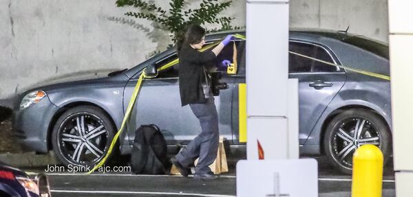 Atlanta police gather evidence at the scene of a shooting outside Patchwerk Recording Studios in northwest Atlanta Tuesday. JOHN SPINK / JSPINK@AJC.COM